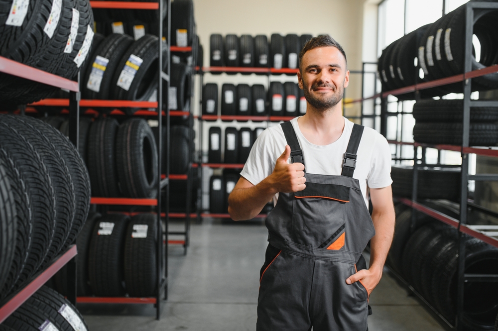 Man making a hands up in tire shop